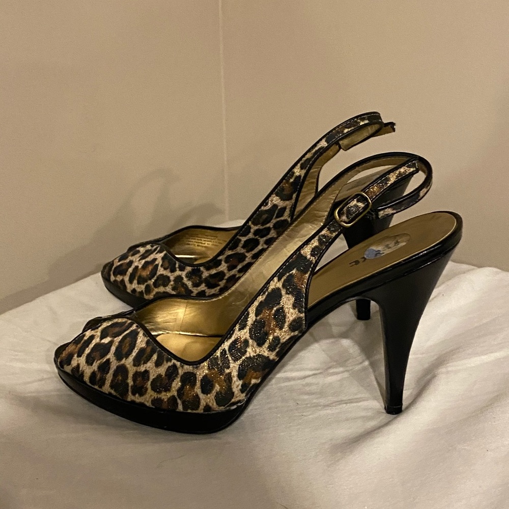 Great condition, Black patent leather leopard print swing back heels